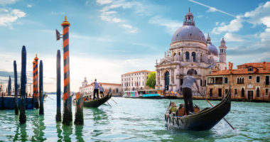 Ride on gondolas along the Gand Canal in Venice, Italy