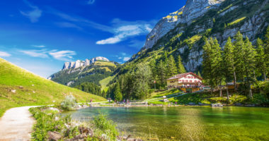 Tourquise clear Seealpsee with the Swiss Alps (mountain Santis) in the background, Appenzeller Land, Switzerland