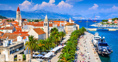 Trogir, Croatia. Sunny promenade along the pier of old Venetian town, Dalmatian Coast in Croatia.
