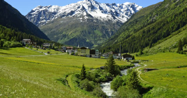 Plangeross, Austria - June 23rd 2016: Tiny village in Pitztal with snowy Tyrolean alps in background, preferred area for skiing and hiking