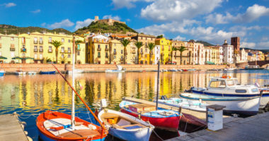 Colorful houses and boats in Bosa, Sardinia island, Italy, Europe