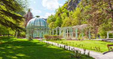 Borjomi Central Historical Park. Georgia. Source with healing mineral water. Beautiful pavilion with a glass dome.