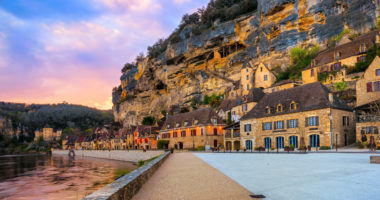 La Roque-Gageac, one of the most beautiful villages of France (Les Plus Beaux Villages), in dramatic sunset light. Roque Gageac is a popular tourist destination in Dordogne region.
