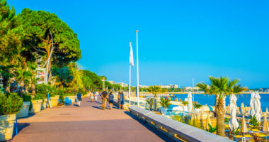 People are strolling on boulevard de la croisette in cannes, France