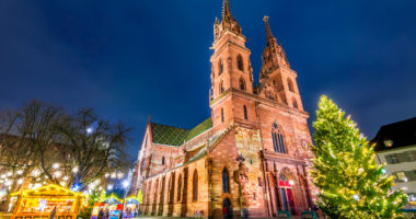 Basel, Switzerland. Christmas fairytale market at Munsterplatz and Munster Cathedral, Swiss Confederation.
