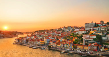 Magnificent sunset over the Porto city center and the Douro river, Portugal. Dom Luis I Bridge is a popular tourist spot as it offers such a beautiful view over the area.