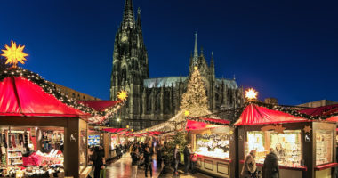 Cologne Cathedral Christmas Market in dusk, Germany. This is the most popular and best-known of all the city markets in front of the famous Cologne Cathedral.