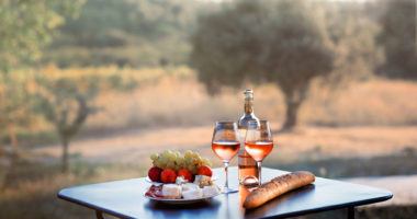 AS_315981354 - Bottle of rose wine and two full glasses of wine 