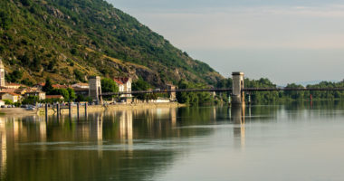 A bridge across tghe Rhone River and the commune of Andance, France