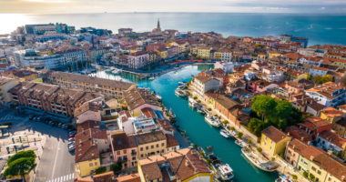 Town of Grado colorful architecture and channels aerial view, Friuli-Venezia Giulia region of Italy