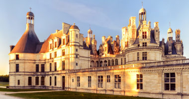 The royal Chateau de Chambord at sunset, France. This castle is located in the Loire Valley, was built in the 16th century and is one of the most recognizable chateaux in the world.
