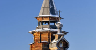 Small wooden church, winter, clear sky at background